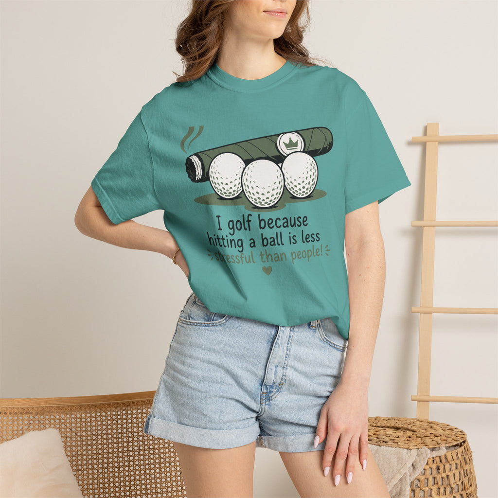 Golf Humor T-Shirt — "I golf because hitting a ball is less stressful than people" - a light, slightly sarcastic tone that lands with fellow players